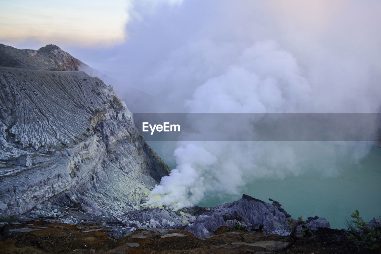 Smoke emitting from volcanic mountain