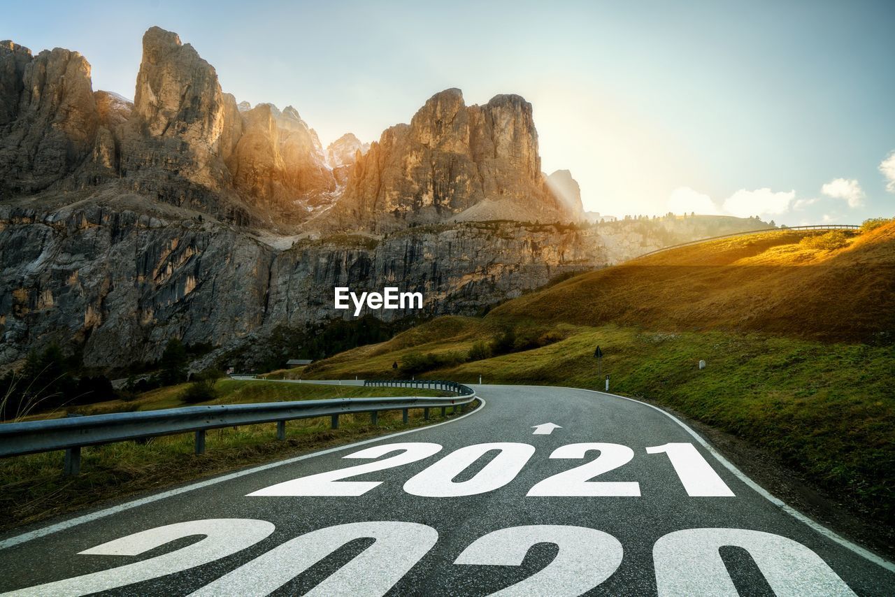 ROAD SIGN BY MOUNTAIN