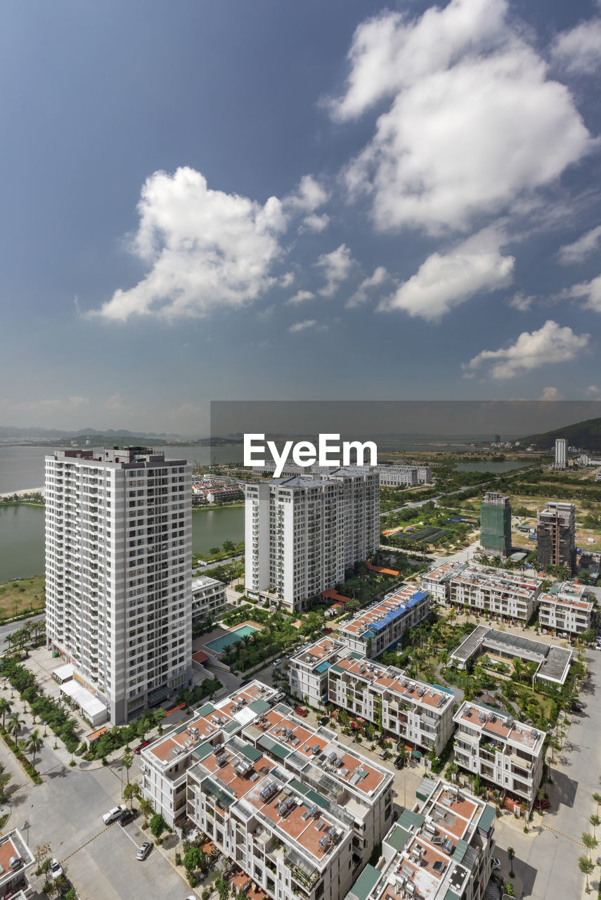 High angle view of buildings in city against sky