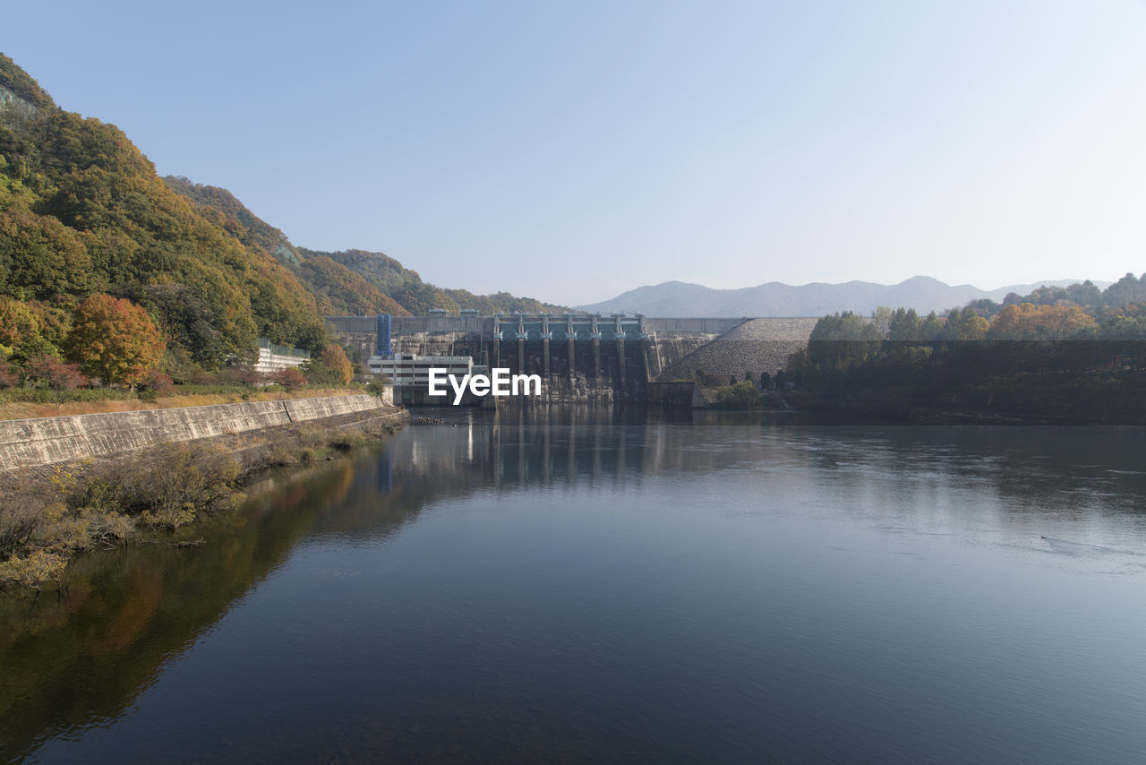 Dam over river against clear sky