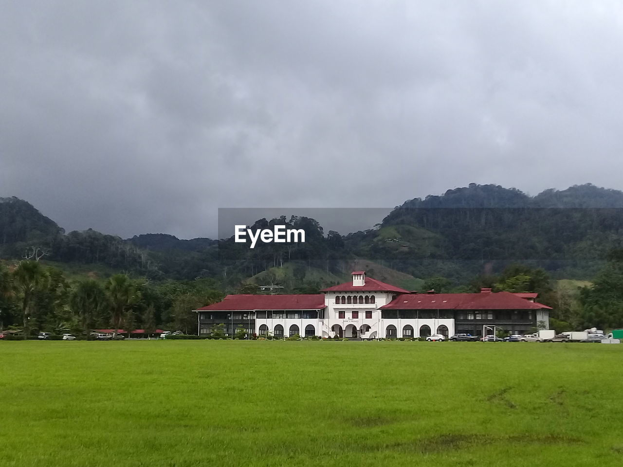 BUILT STRUCTURE ON FIELD AGAINST SKY