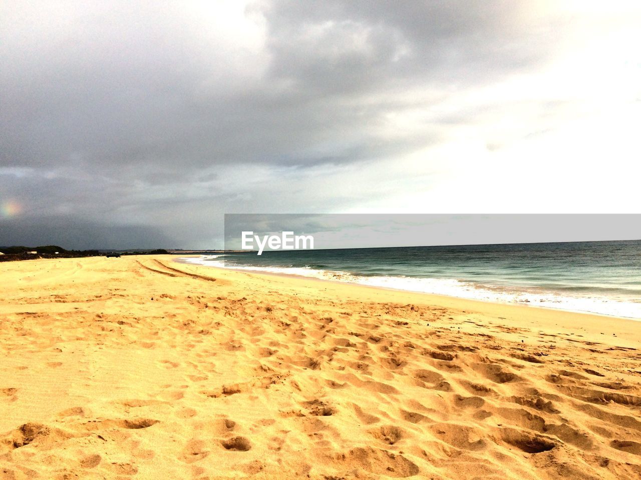 BEACH AGAINST SKY