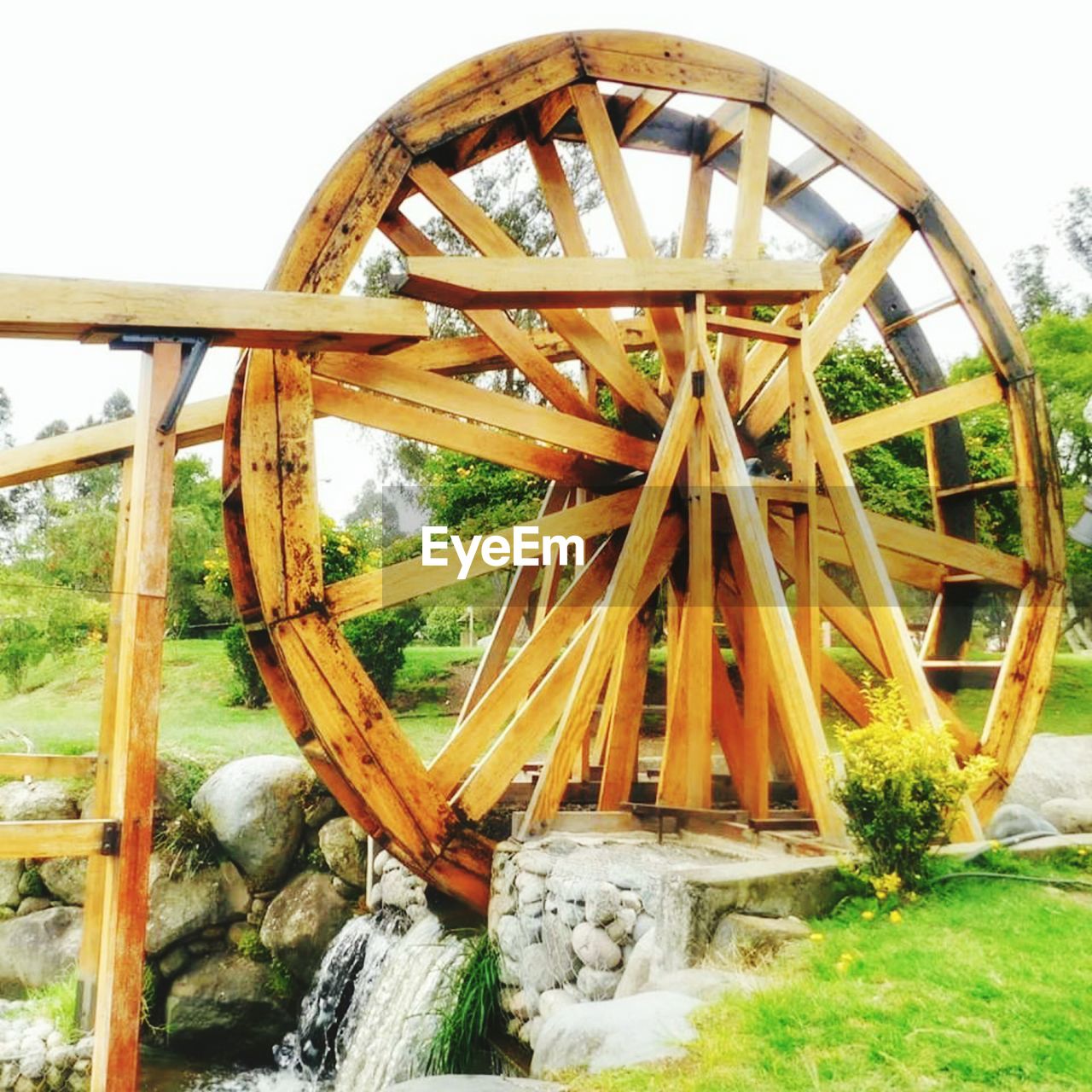 VIEW OF WOODEN STRUCTURE BY RIVER