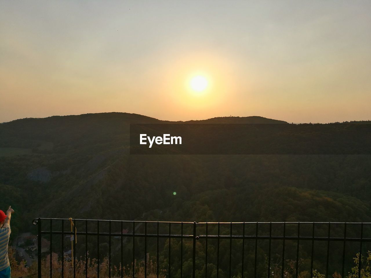 SCENIC VIEW OF MOUNTAINS AT SUNSET