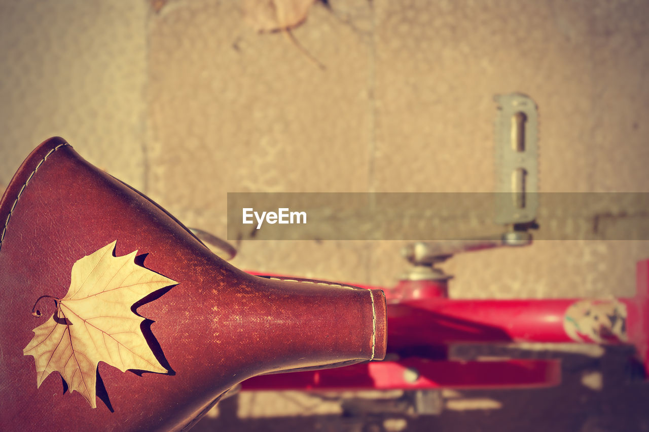 CLOSE-UP OF BICYCLE AGAINST WALL