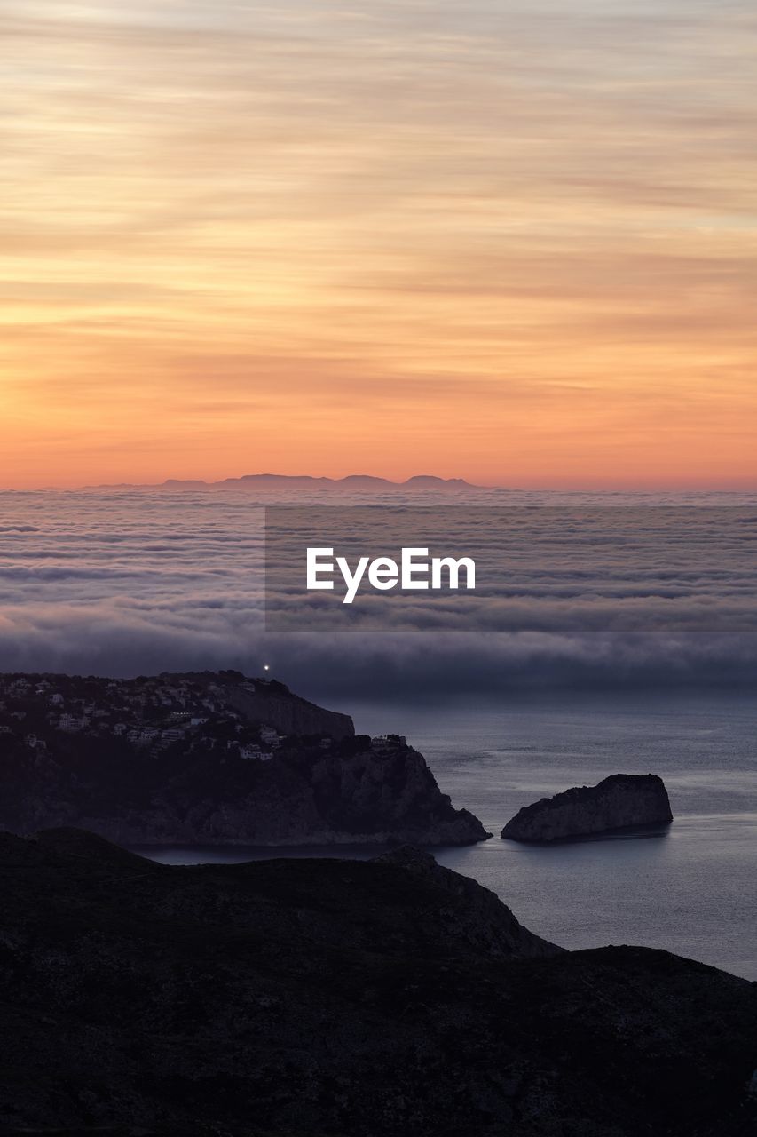 Scenic view of sea against sky during sunset