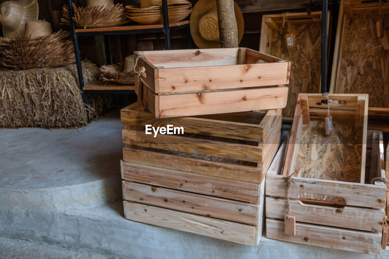 STACK OF WOODEN CHAIR IN BASKET