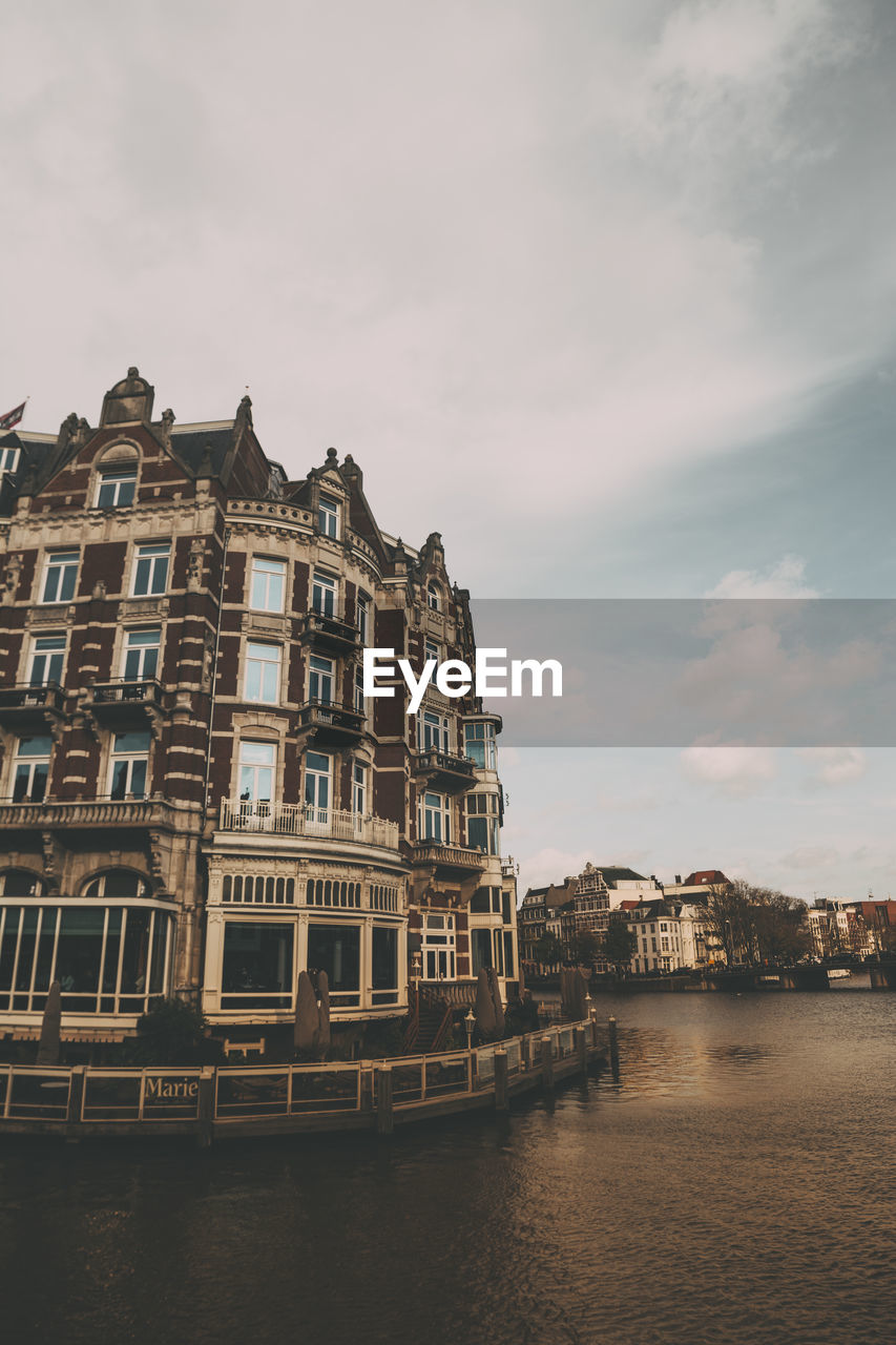 View of buildings against cloudy sky