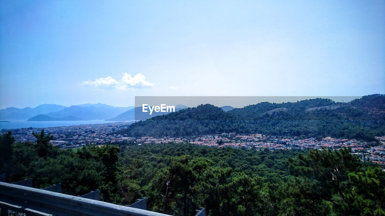 Scenic view of mountains and sea against sky