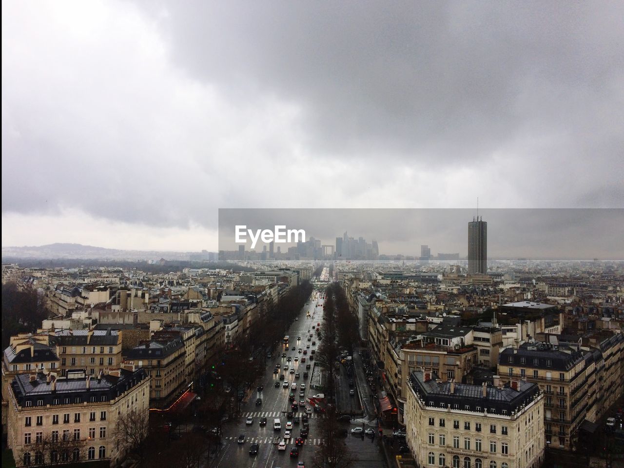 HIGH ANGLE VIEW OF BUILDINGS AGAINST CLOUDY SKY