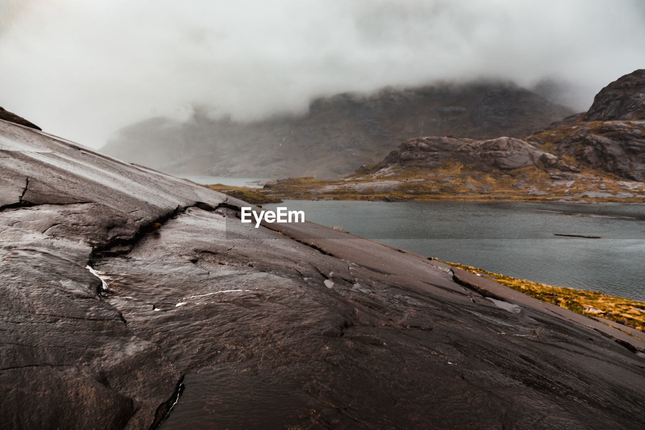 SCENIC VIEW OF VOLCANIC LANDSCAPE AGAINST SKY