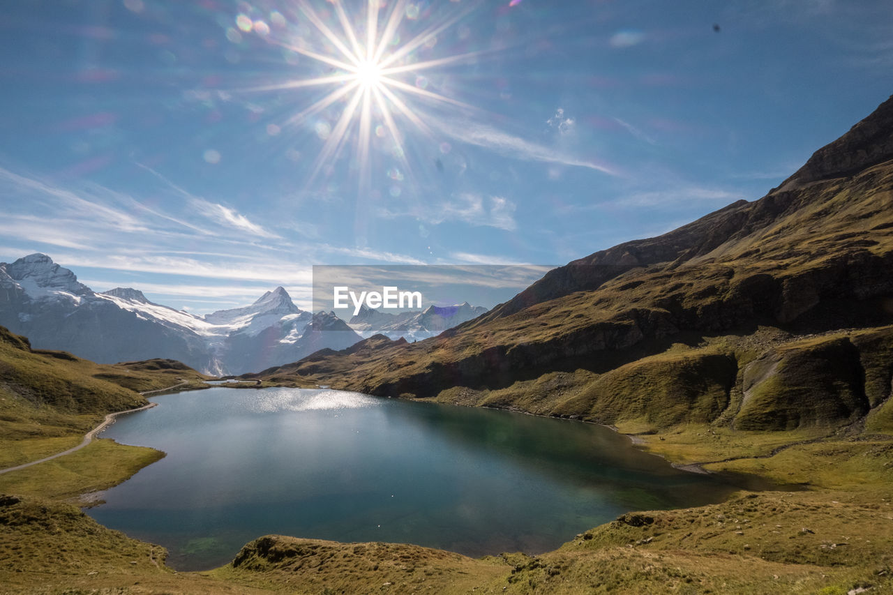 Sun shining over lake