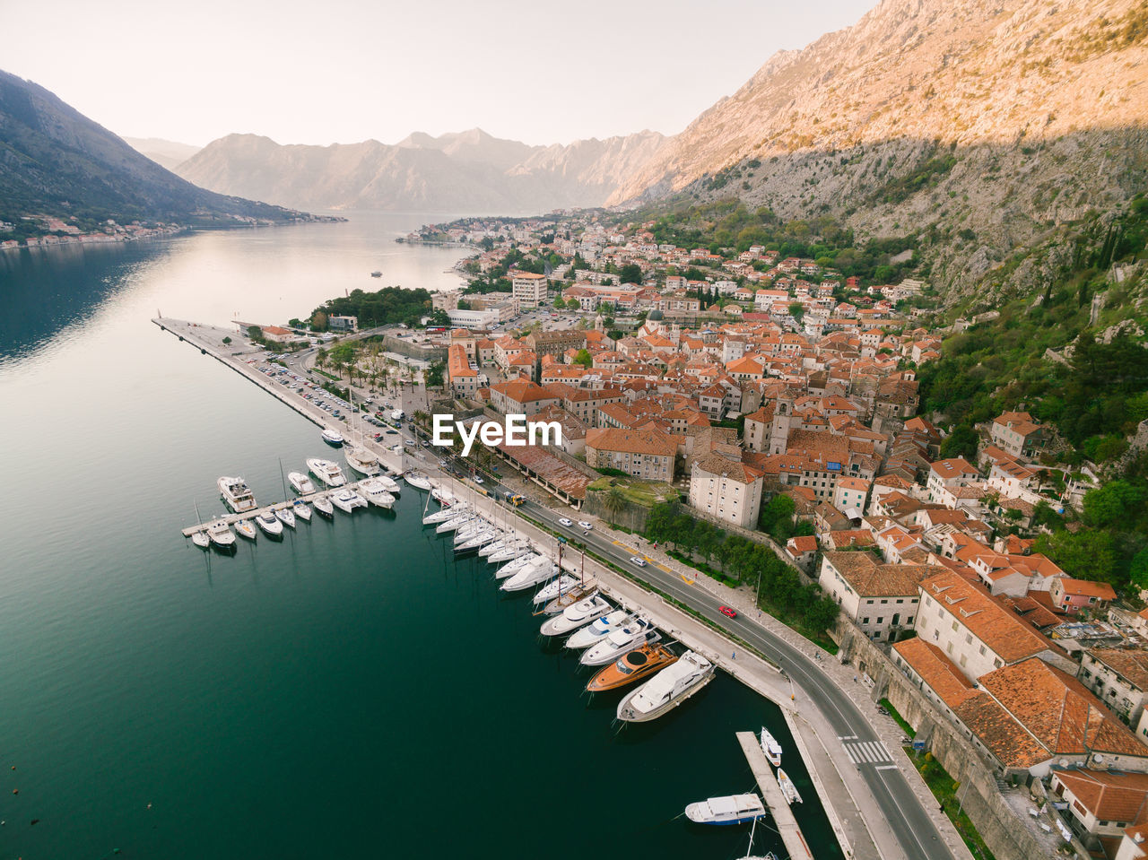 HIGH ANGLE VIEW OF RIVER BY BUILDINGS