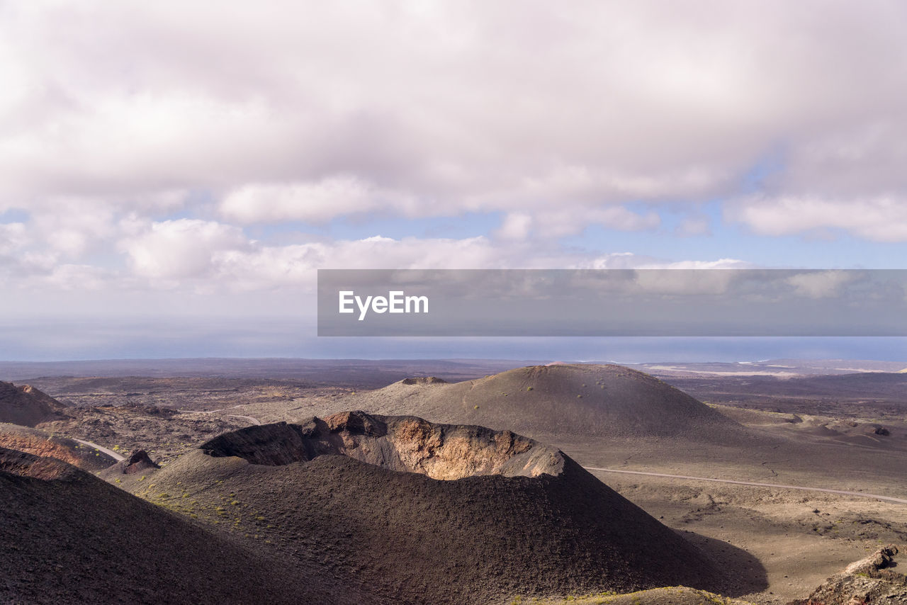 Aerial view of volcano landscape against sky