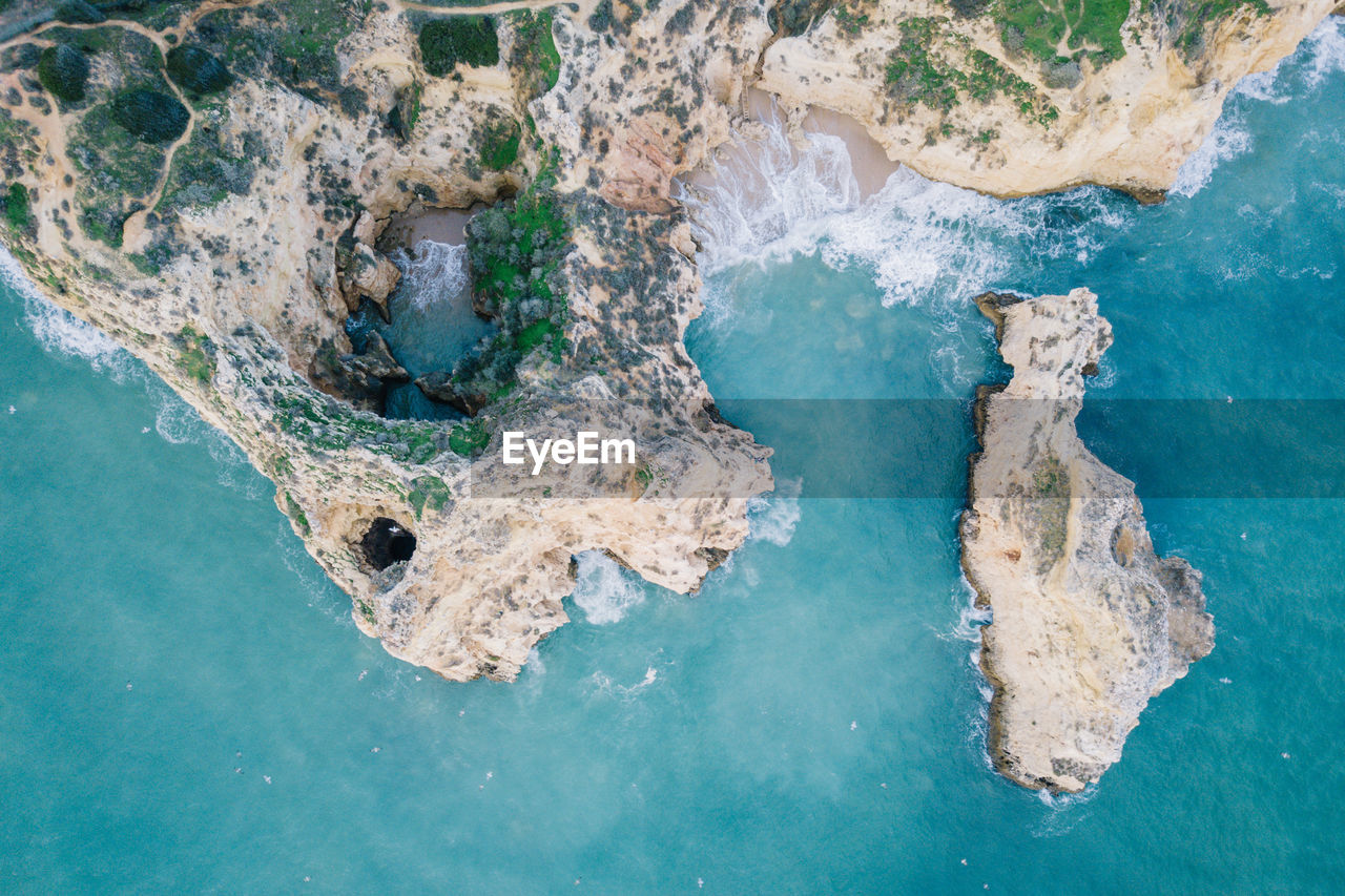 AERIAL VIEW OF ROCK IN SEA