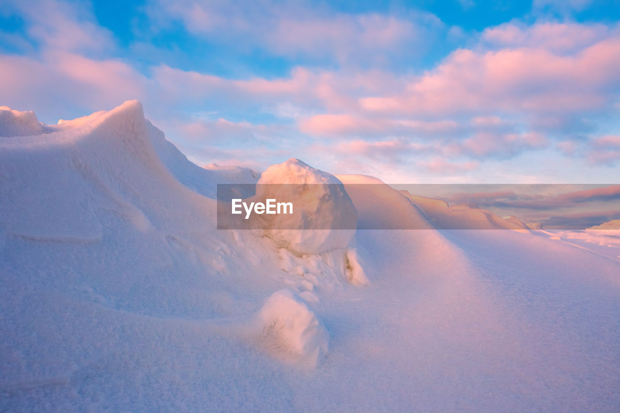 scenic view of snow covered mountains against sky