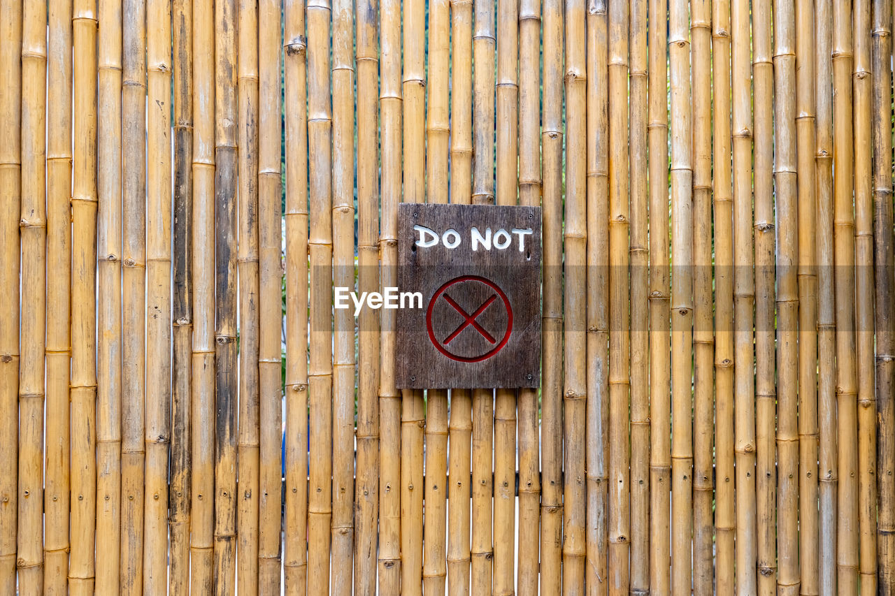 CLOSE-UP OF TEXT ON WOOD