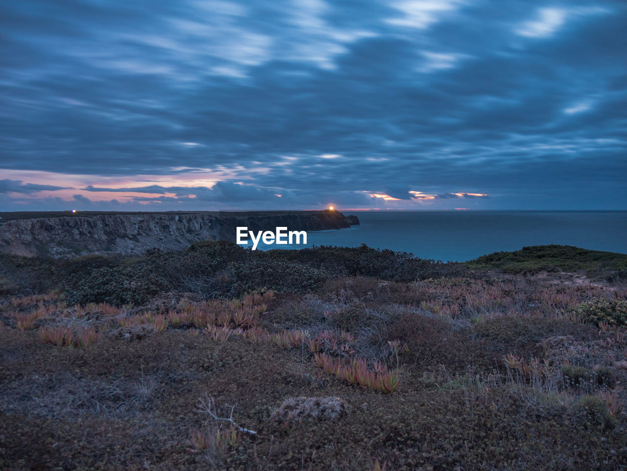 Scenic view of sea against sky at sunset