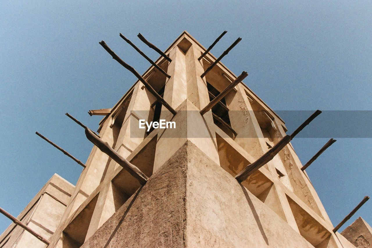 Low angle view of incomplete building against clear sky