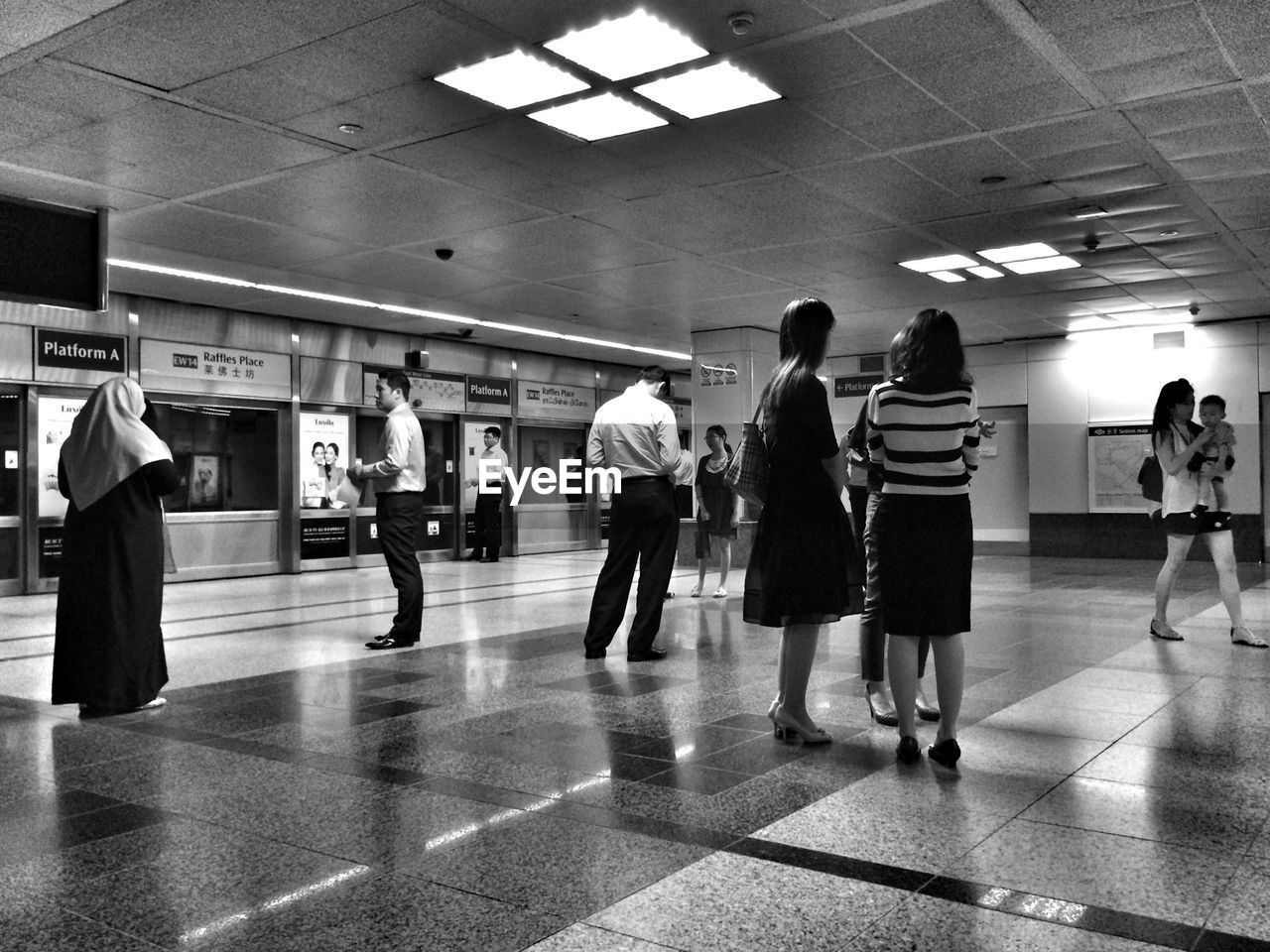 PEOPLE WAITING IN SUBWAY