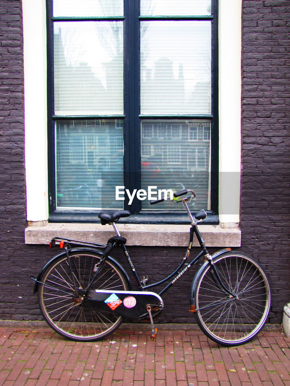 BICYCLE PARKED ON WINDOW