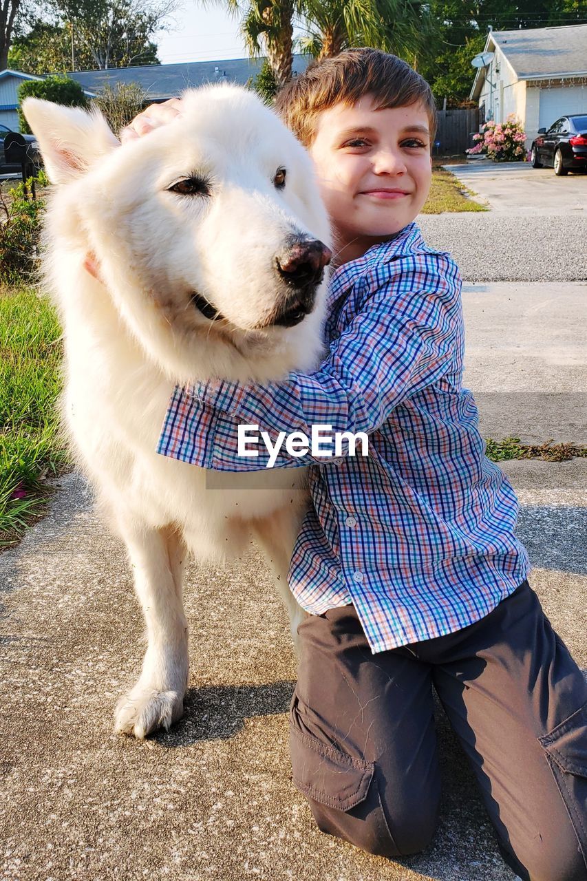 Portrait of cute girl with dog