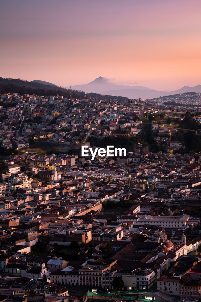 High angle view of city at sunset