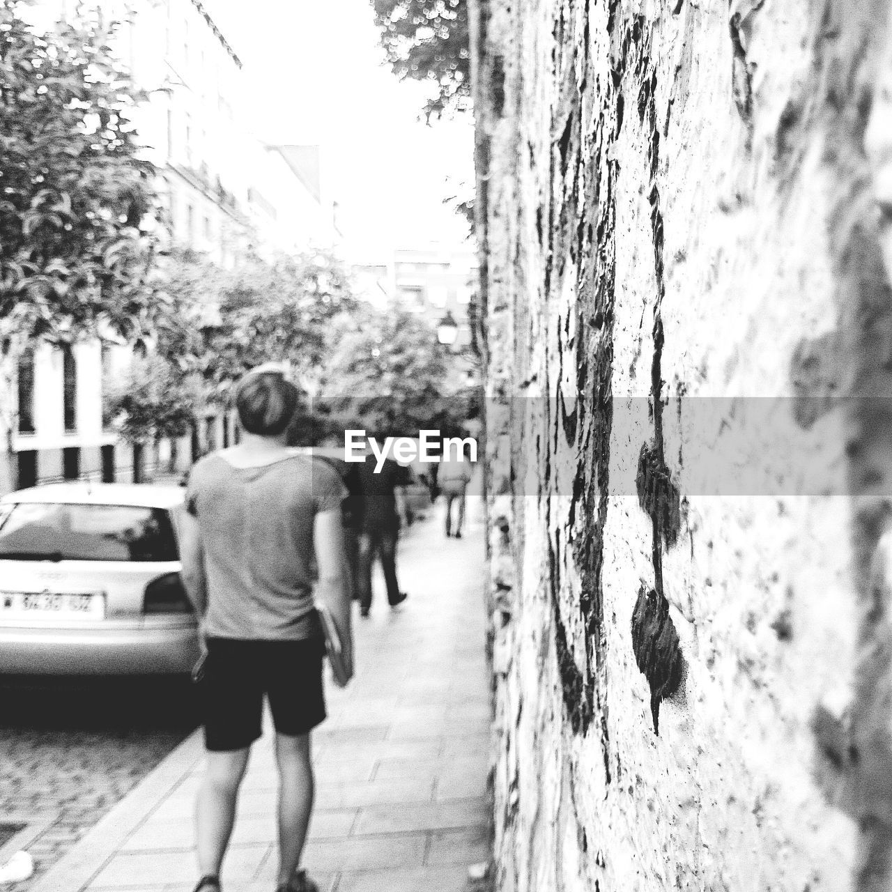 WOMAN WALKING ON ROAD