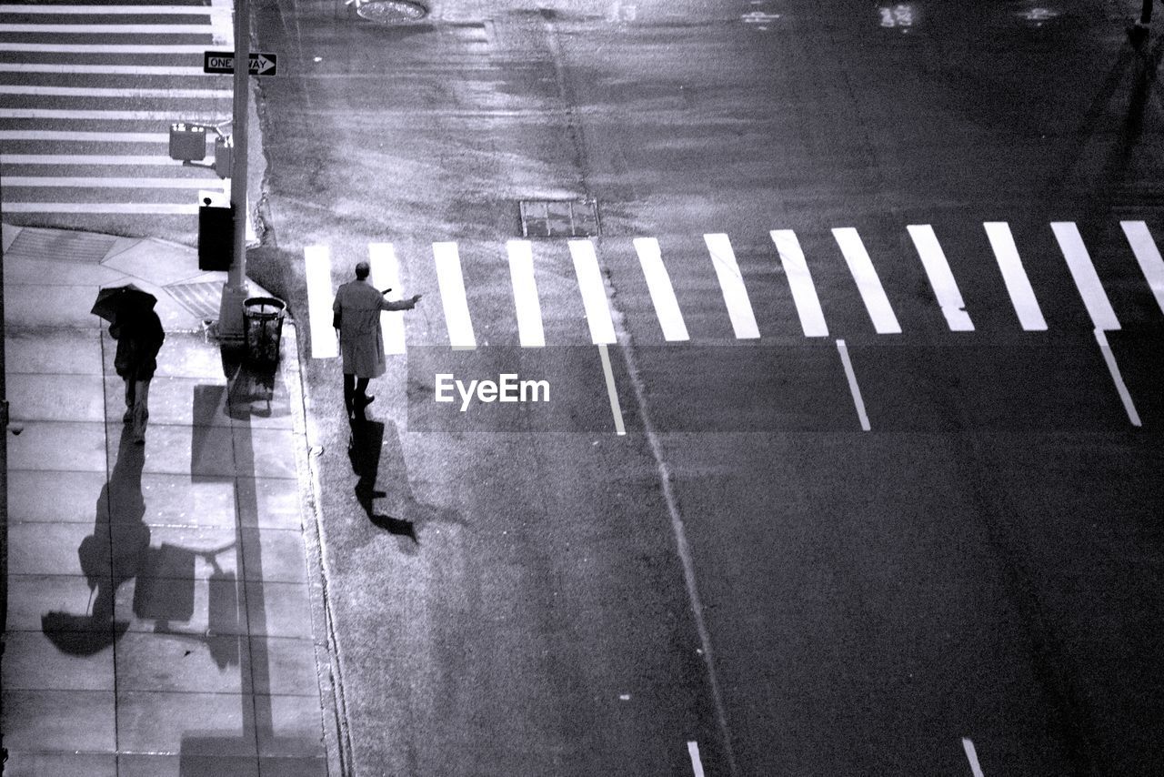 High angle view of people on street at night