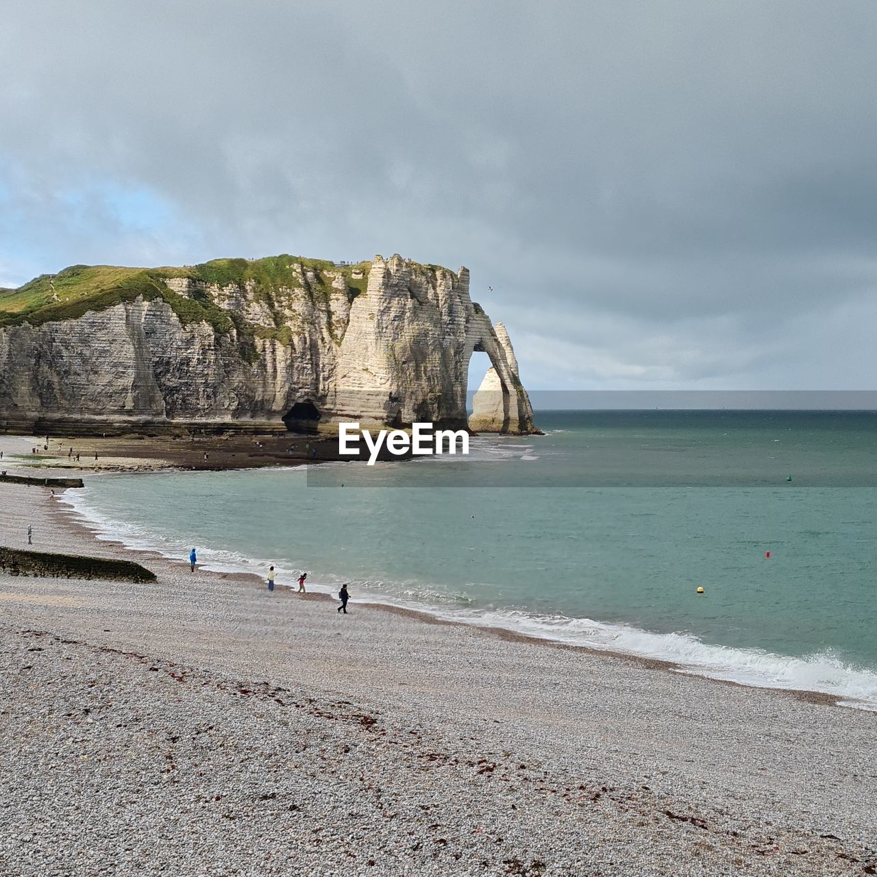 sea, land, beach, water, sky, shore, scenics - nature, body of water, ocean, beauty in nature, coast, nature, cloud, rock, sand, coastline, travel destinations, wave, cliff, holiday, tranquility, trip, vacation, travel, tranquil scene, environment, bay, tourism, non-urban scene, terrain, idyllic, rock formation, horizon, horizon over water, cove, landscape, day, outdoors, water's edge, island, seascape, wind wave, overcast, coastal feature