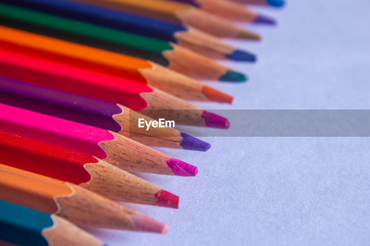 Close-up of colored pencils on table