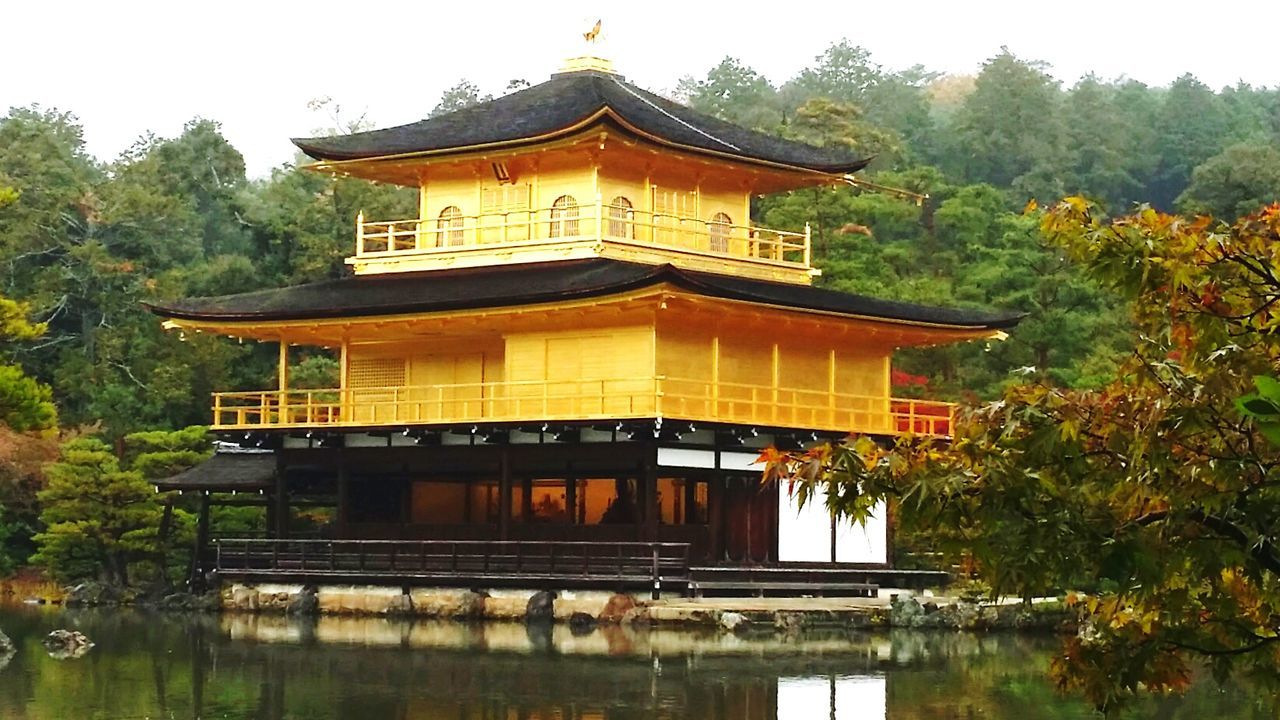 TEMPLE BY LAKE AGAINST BUILDING