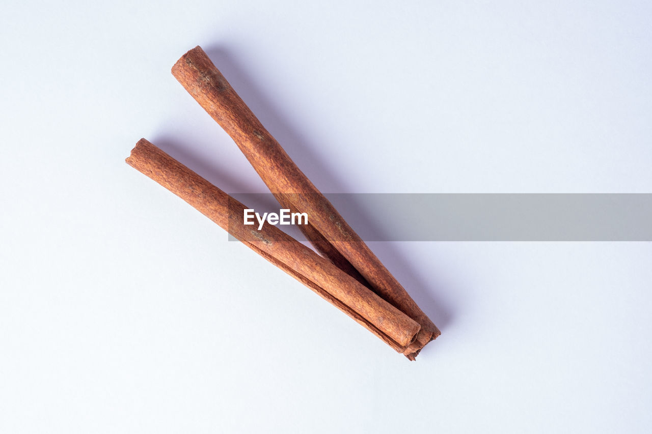 HIGH ANGLE VIEW OF BREAD ON WHITE SURFACE