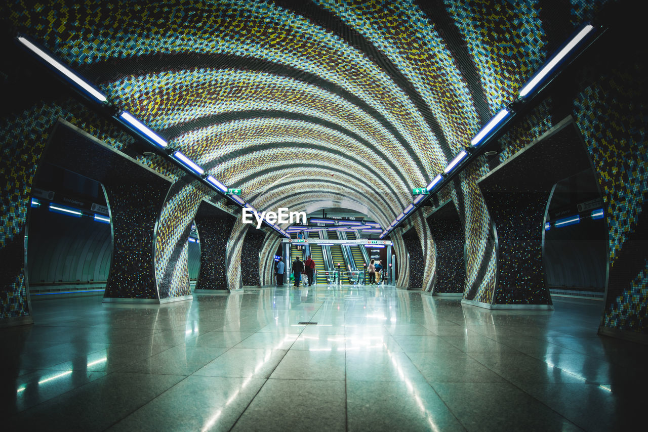 INTERIOR OF ILLUMINATED MODERN AIRPORT