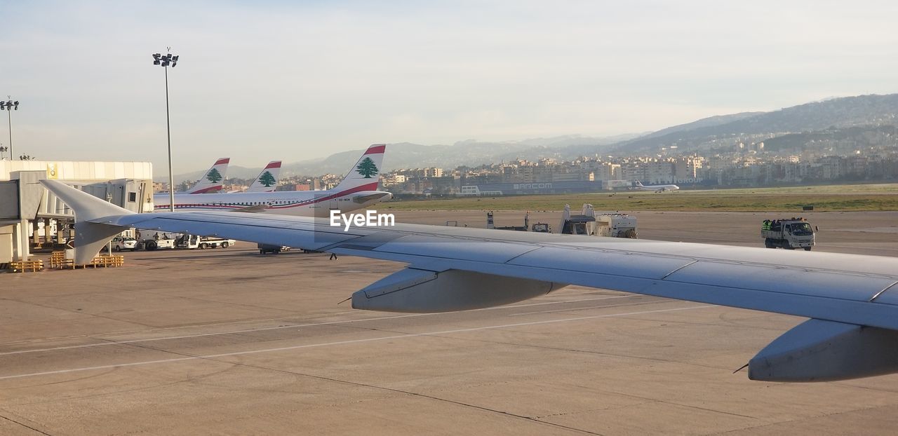 AIRPORT RUNWAY AGAINST SKY