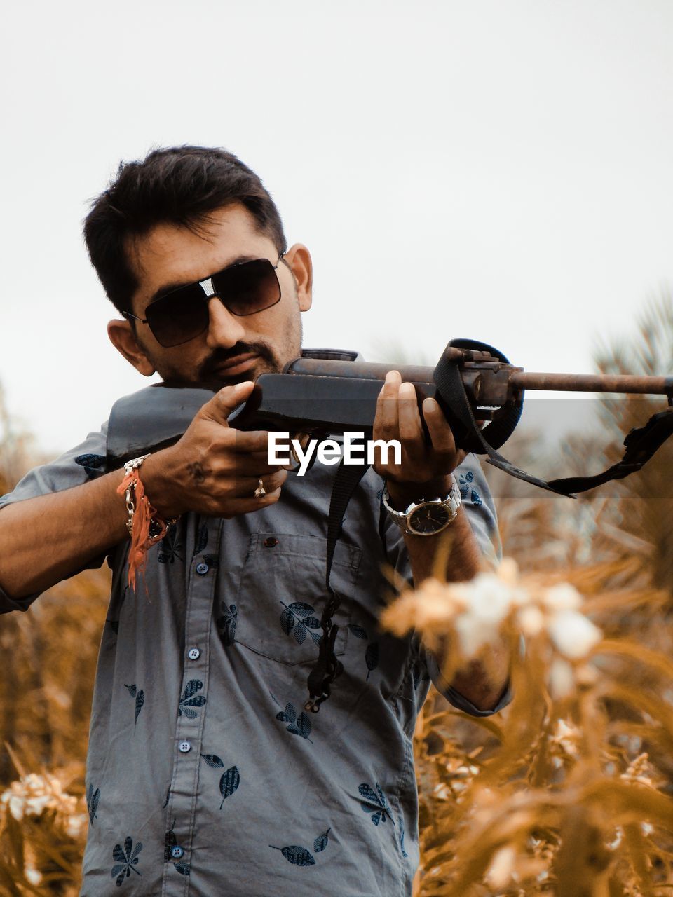 Young man with gun.