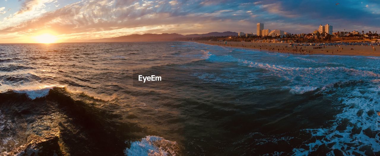 SCENIC VIEW OF SEA AT SUNSET