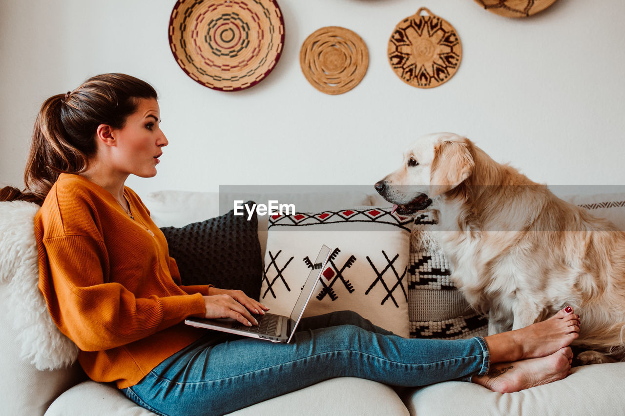 Woman with dog at home