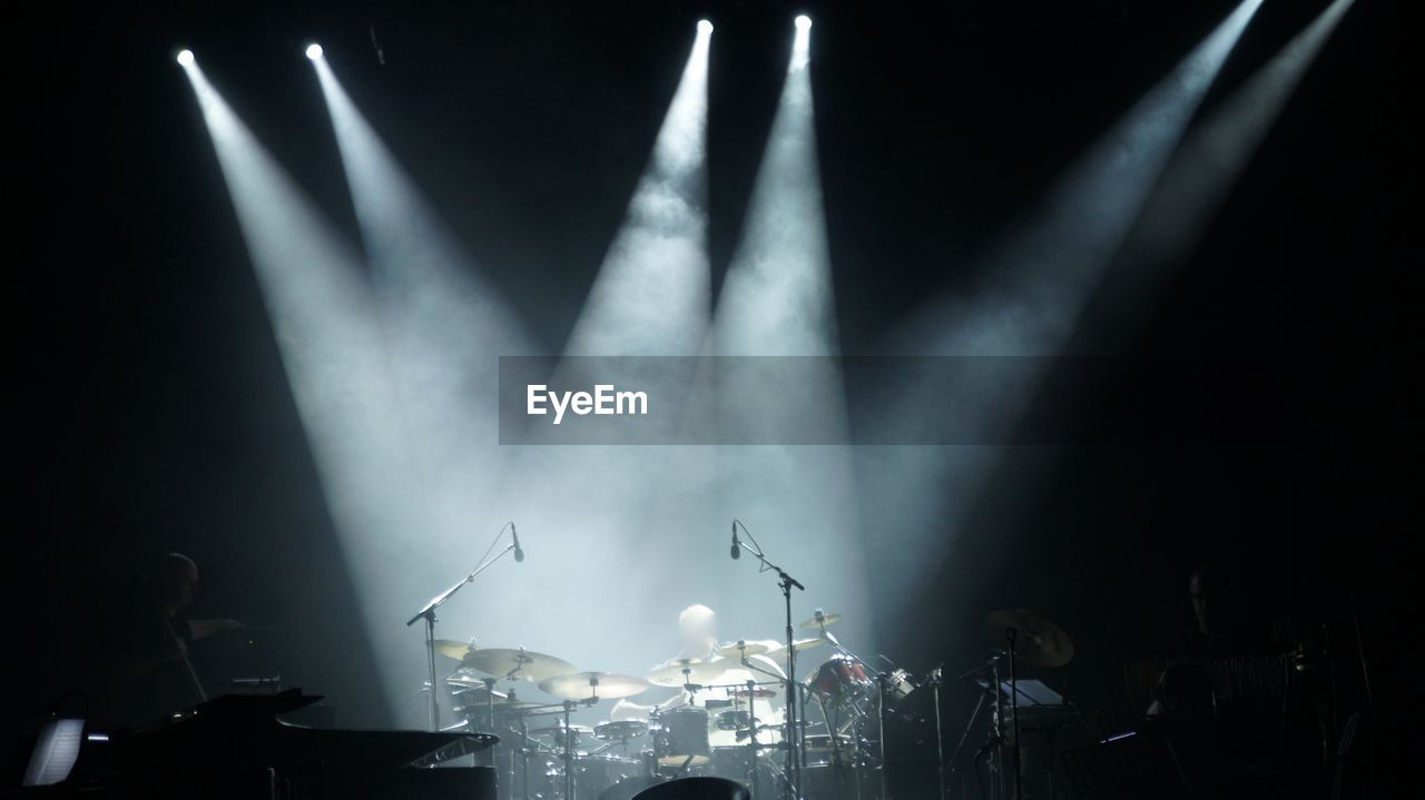 Spotlights on drums at concert