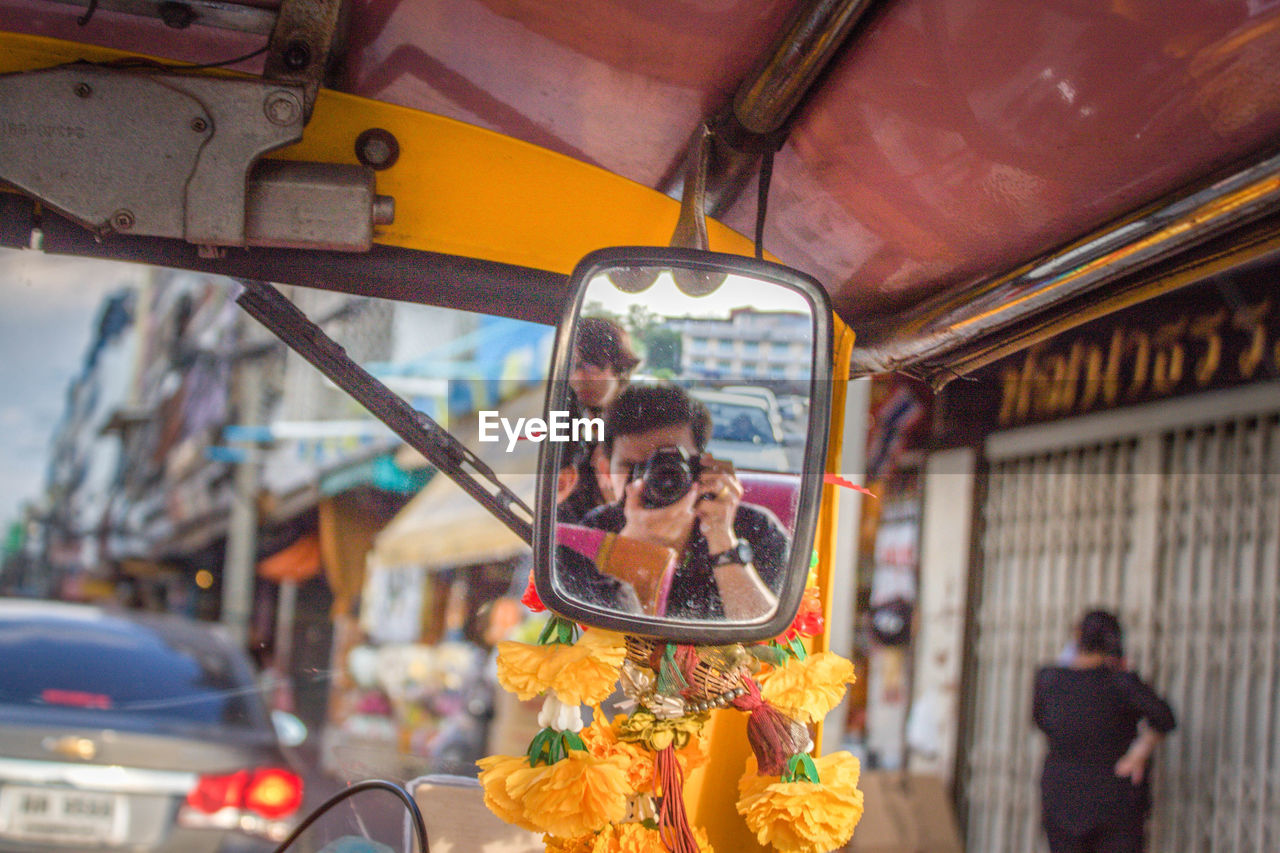 REFLECTION OF WOMAN IN CAROUSEL