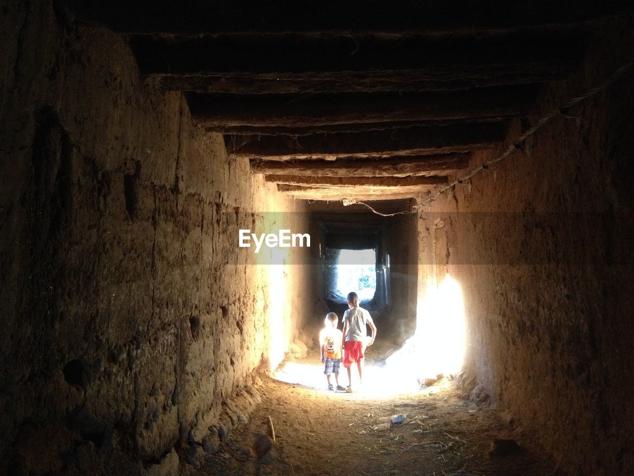 Sunlight falling on children at historical building