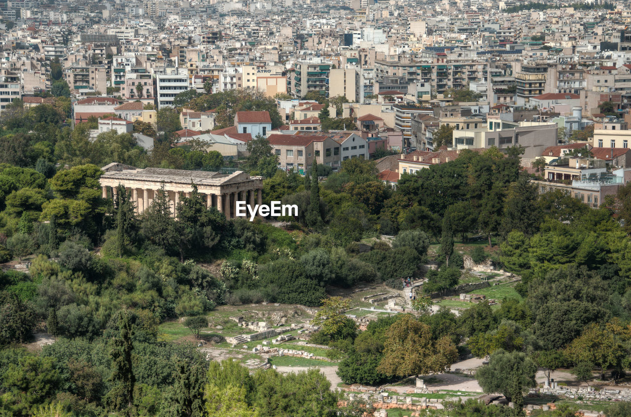 High angle view of houses and trees in city