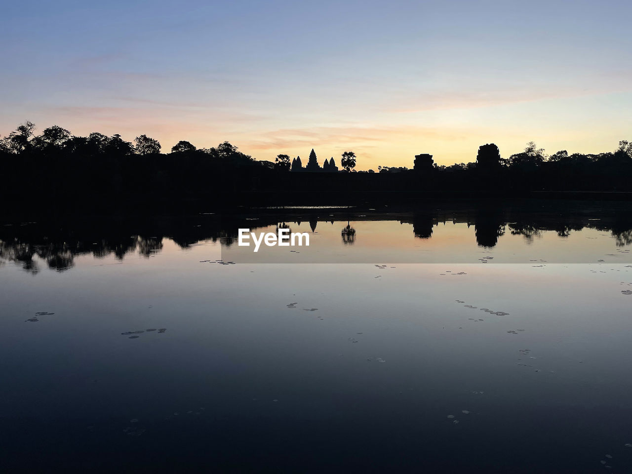 reflection, water, sky, dawn, morning, lake, nature, tranquility, silhouette, sunrise, beauty in nature, scenics - nature, tranquil scene, environment, tree, landscape, cloud, horizon, no people, sun, plant, sunlight, outdoors, twilight, travel destinations, idyllic