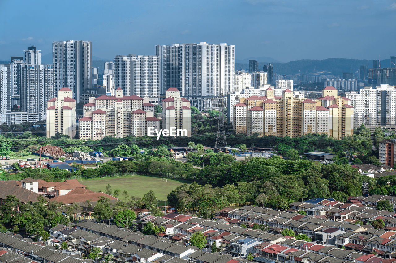 Residential district in city against ble sky