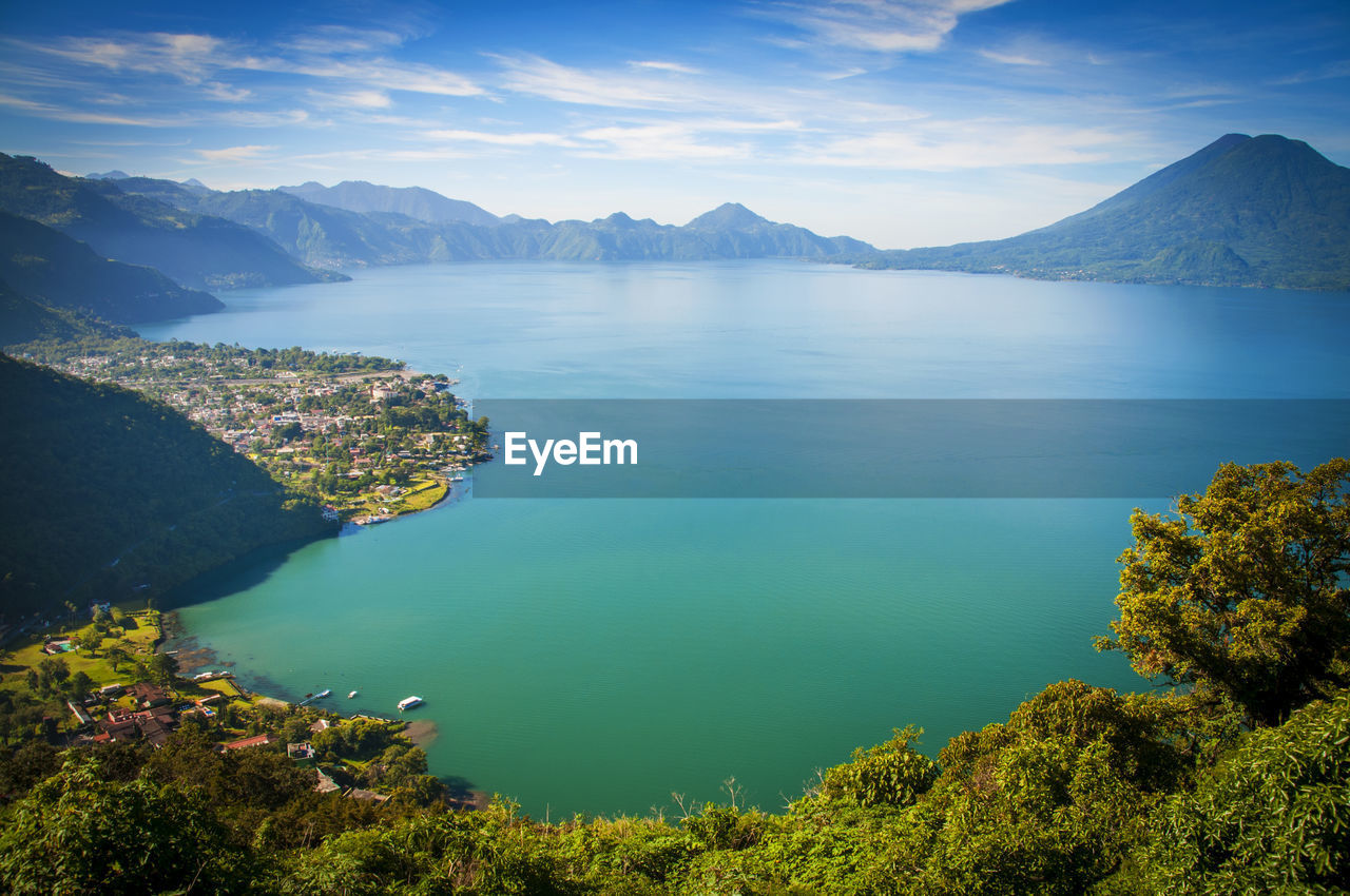 Scenic view of lake and mountains against sky