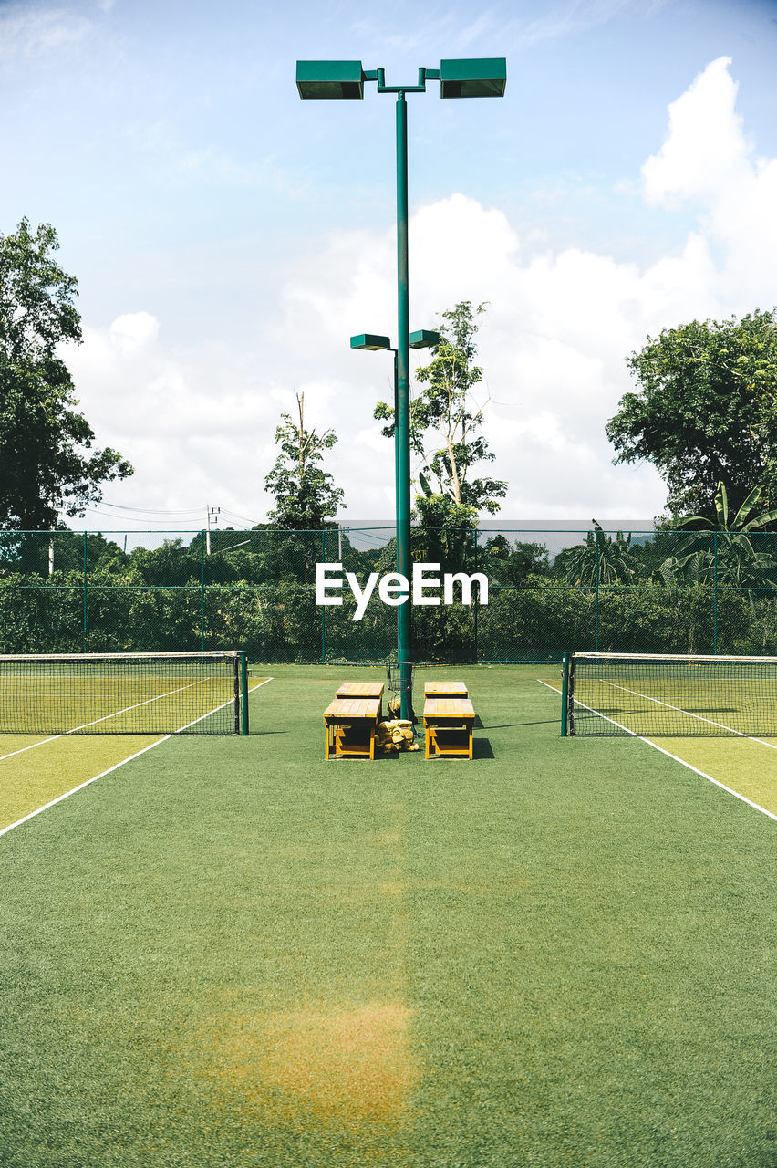 View of soccer field against cloudy sky