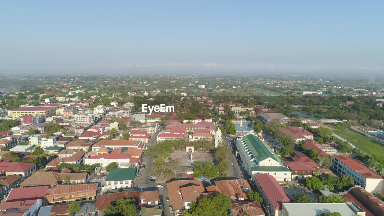 HIGH ANGLE SHOT OF TOWNSCAPE AGAINST CLEAR SKY