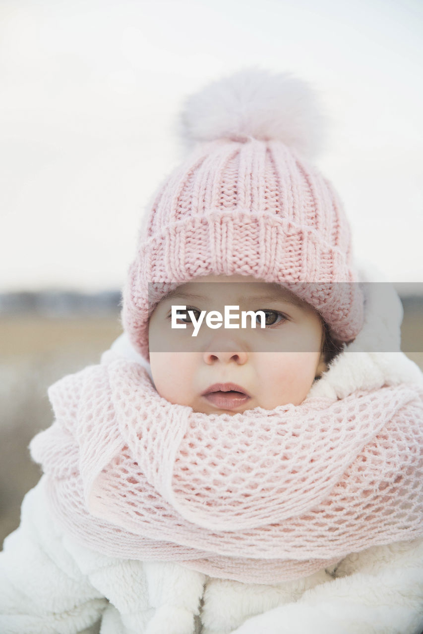 portrait of cute girl wearing knit hat