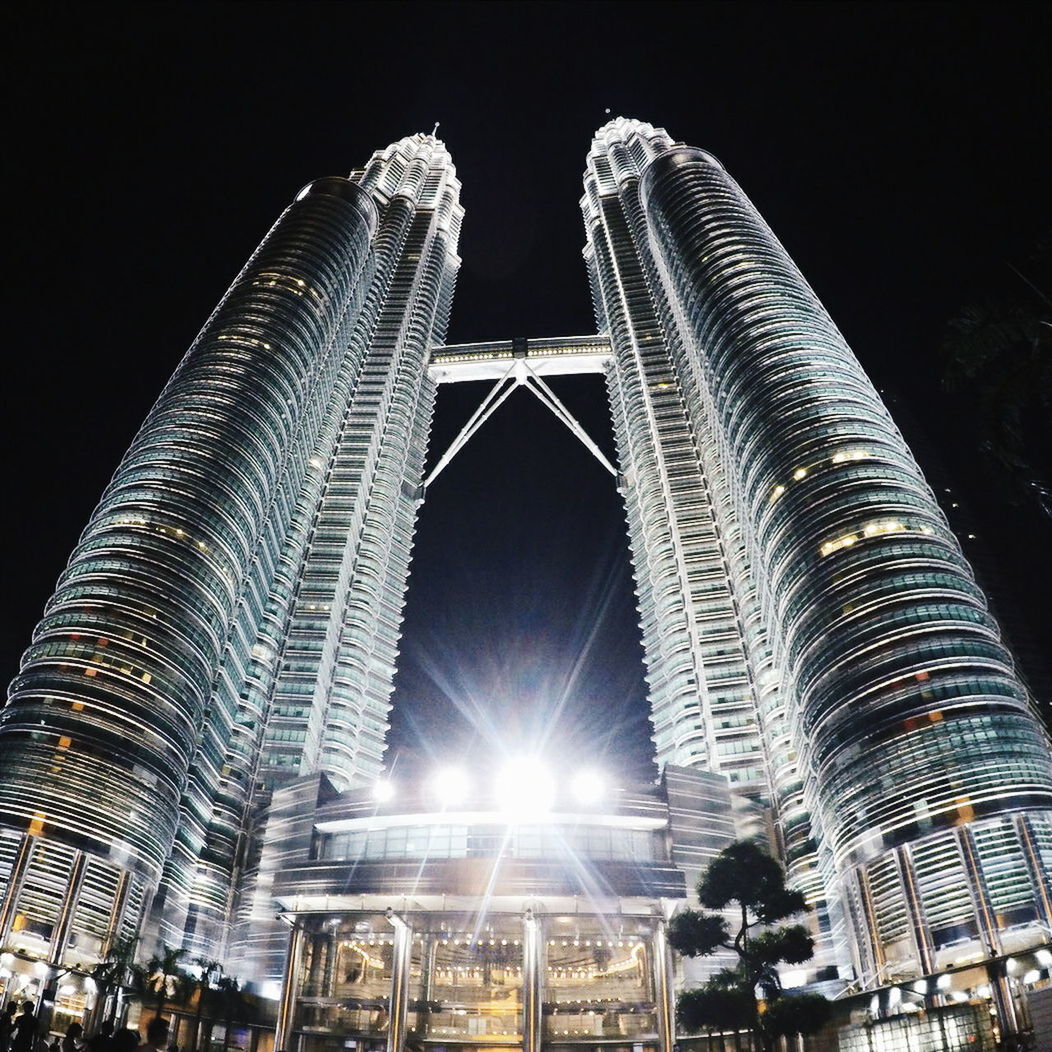 Low angle view of illuminated petronas towers