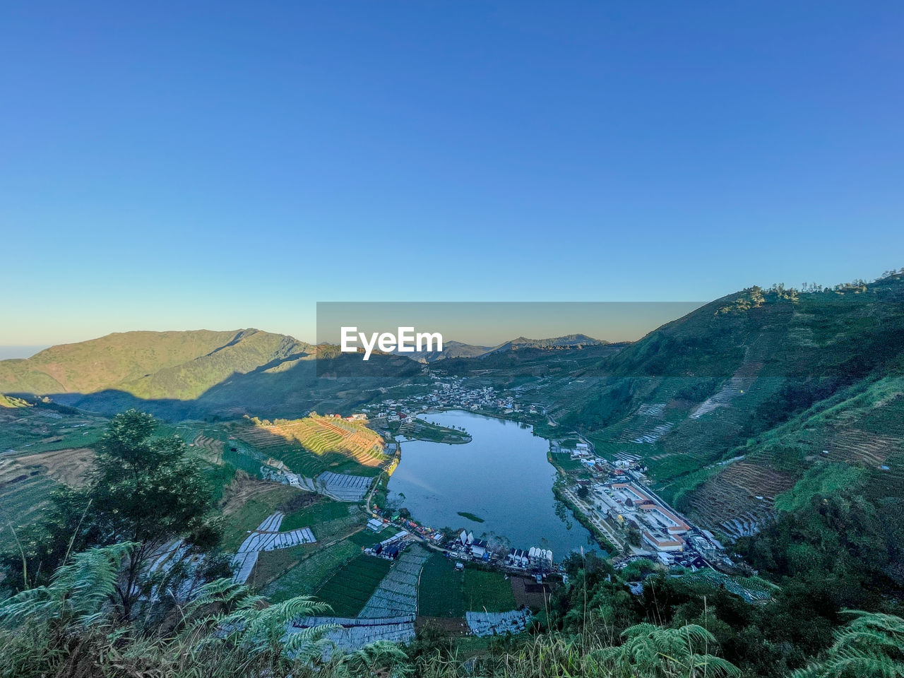 scenics - nature, mountain, environment, sky, landscape, beauty in nature, nature, water, mountain range, blue, land, tranquility, lake, clear sky, tranquil scene, no people, travel destinations, travel, plant, non-urban scene, outdoors, day, copy space, tree, idyllic, wilderness, tourism, high angle view, ridge, sunny